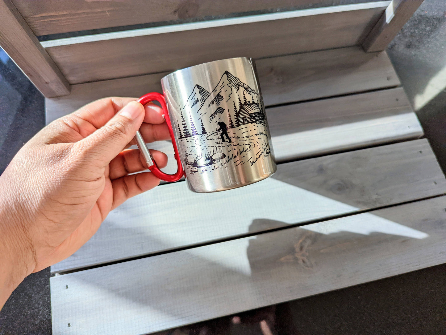 Stainless steel mug with red carabiner clip