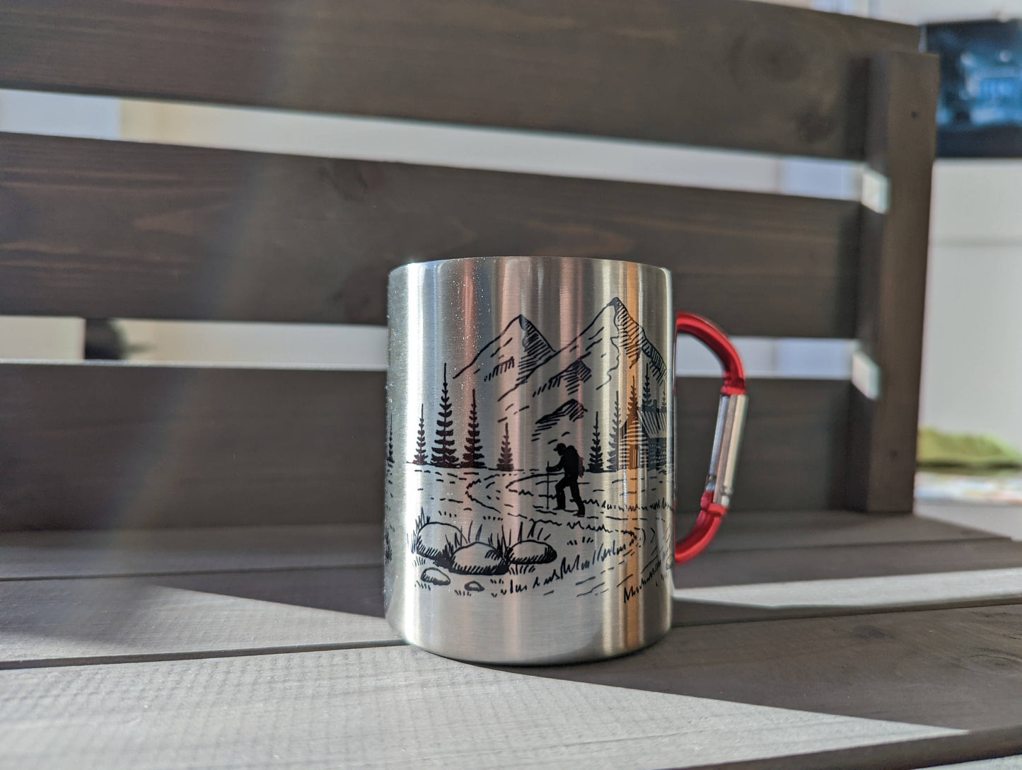 Stainless steel mug with red carabiner clip