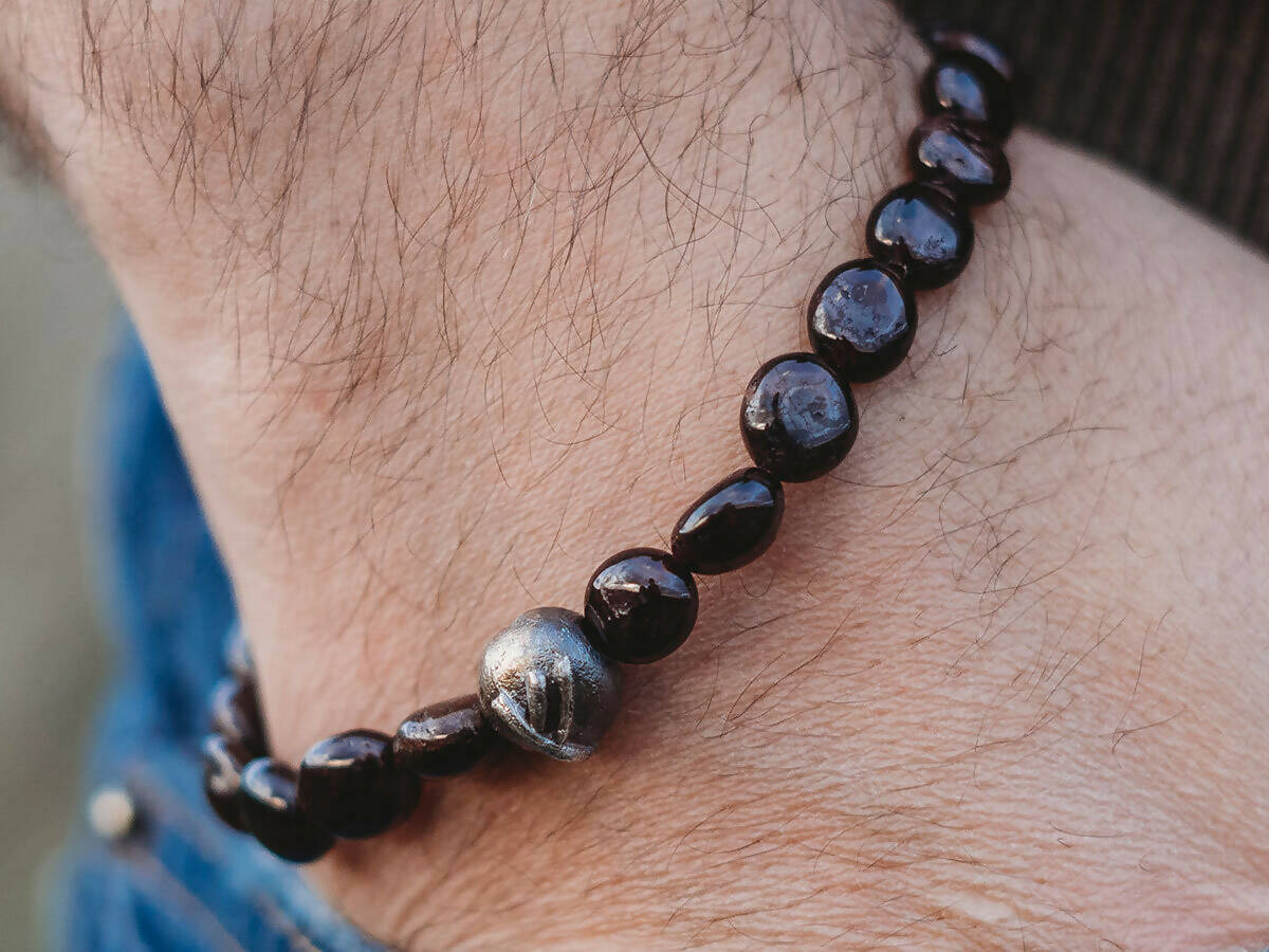 Fehu silver rune bracelet with garnets.