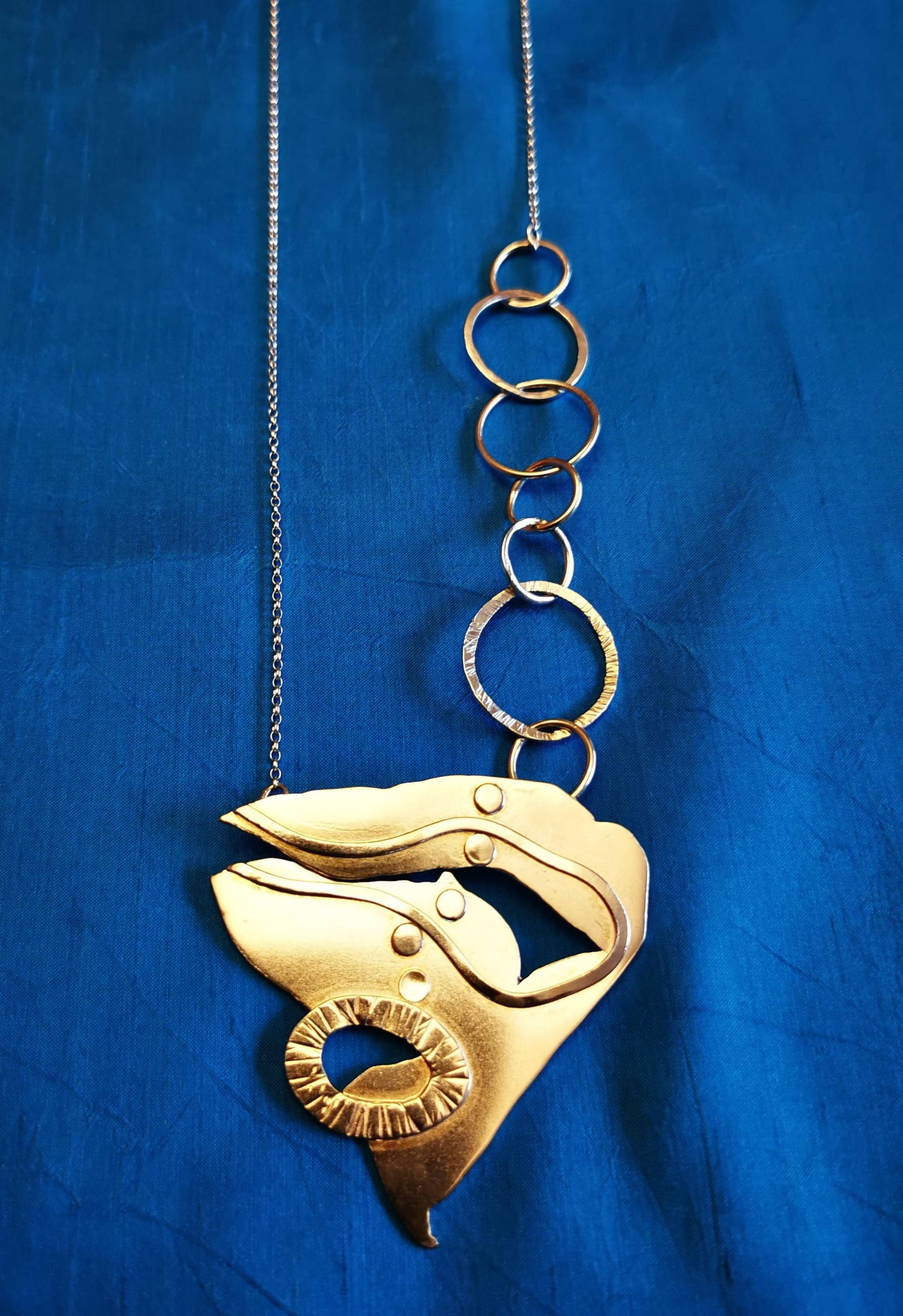 Triangular silver pendant