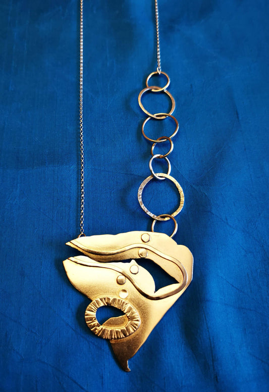 Triangular silver pendant