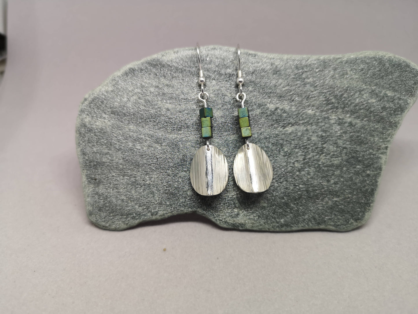 Textured drop earrings with teal hematite cubes