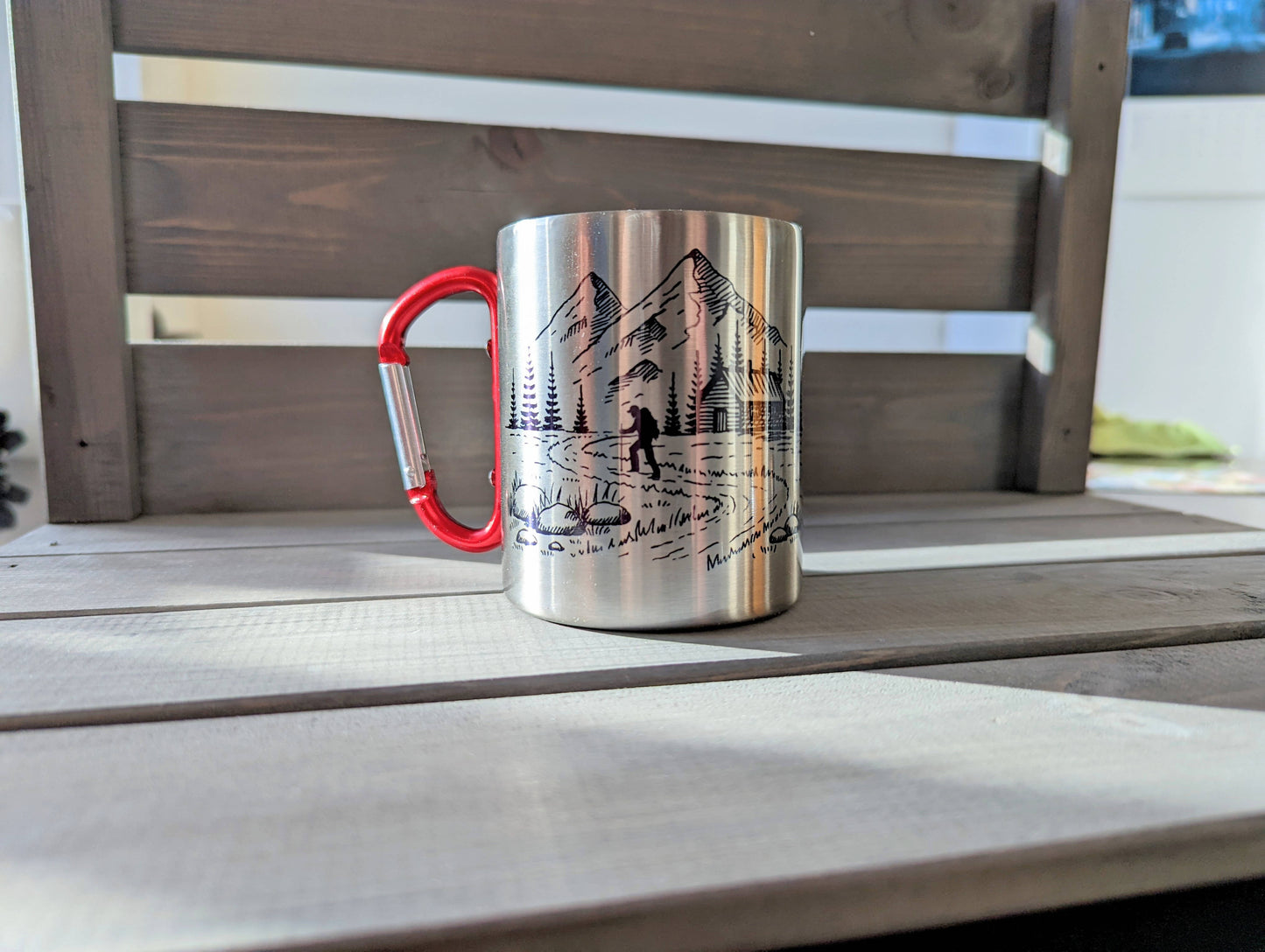 Stainless steel mug with red carabiner clip