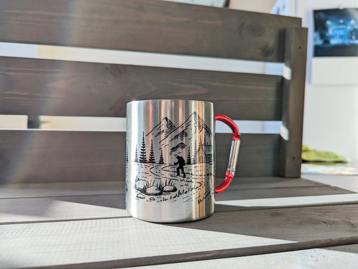 Stainless steel mug with red carabiner clip