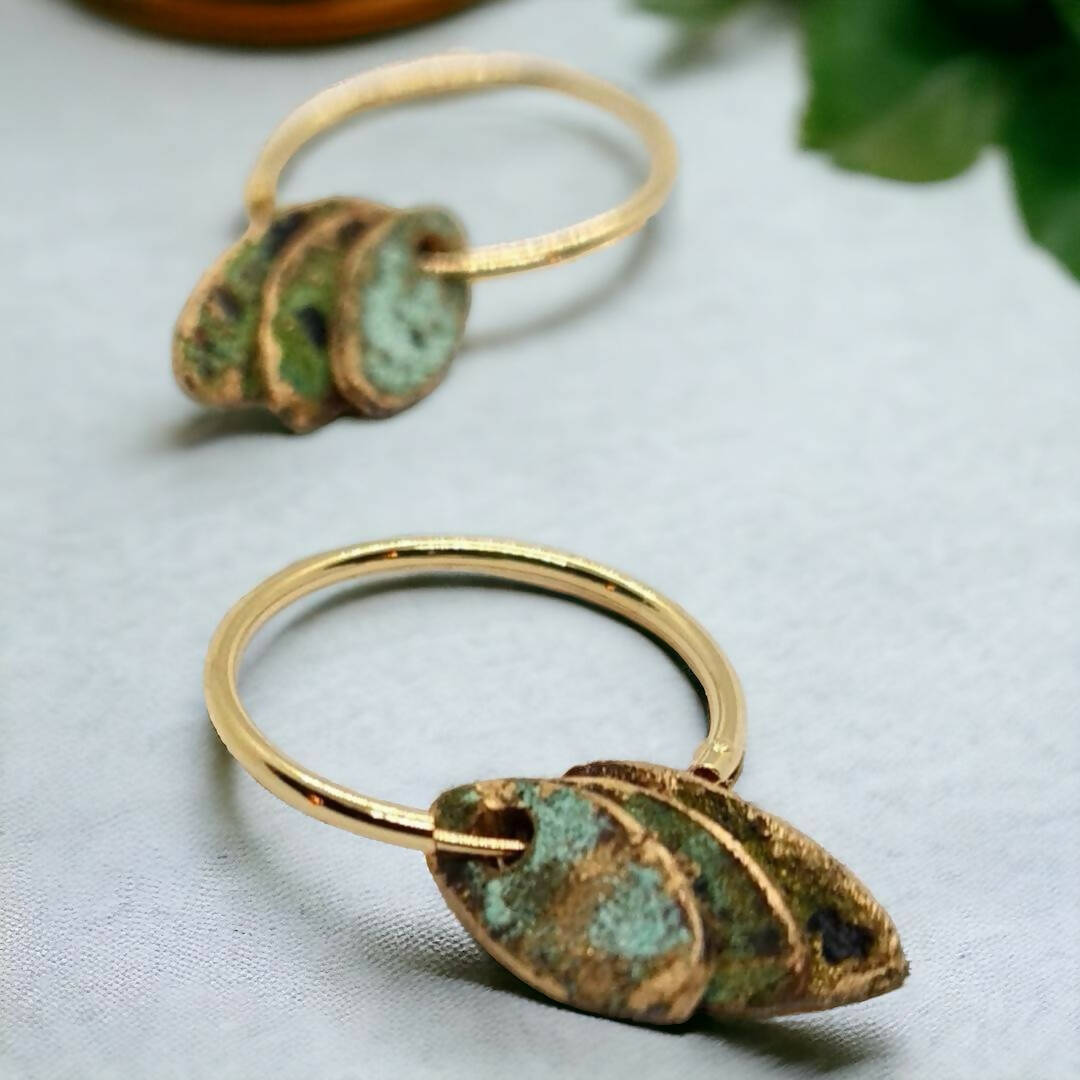 9K Gold Found Beneath Hoops