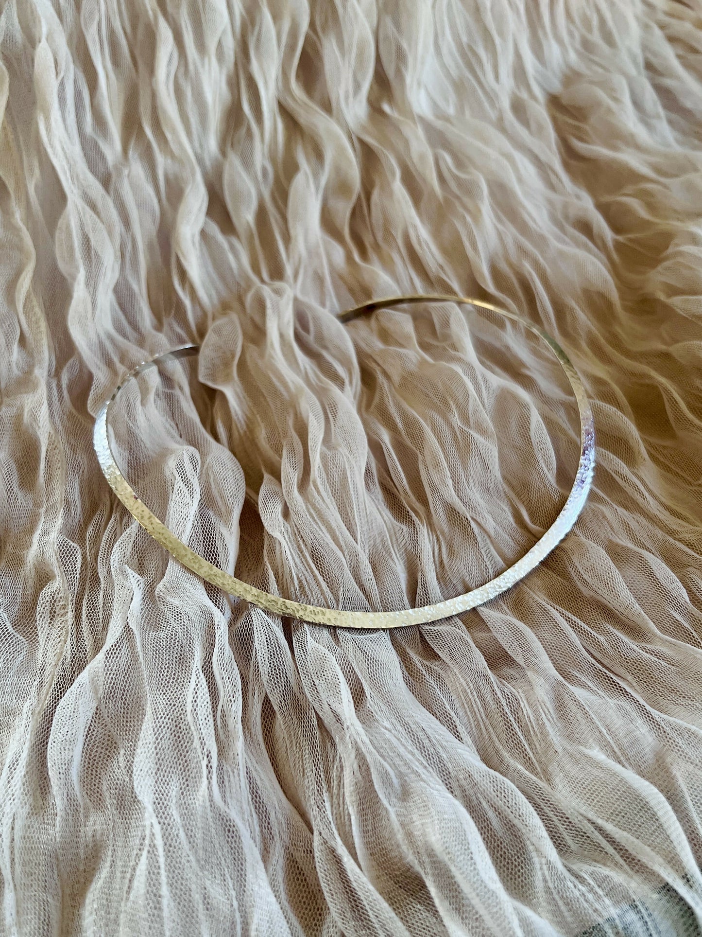 Hammered silver choker necklace.