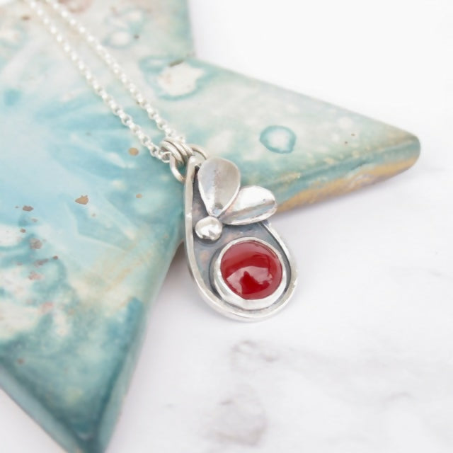 Sterling silver botanical necklace with carnelian gemstone