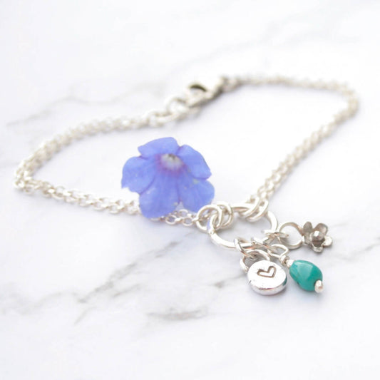 Sterling silver charm bracelet with turquoise gemstone