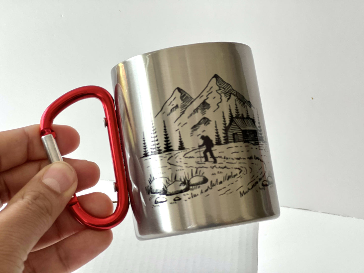 Stainless steel mug with red carabiner clip