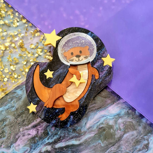 Otter space brooch