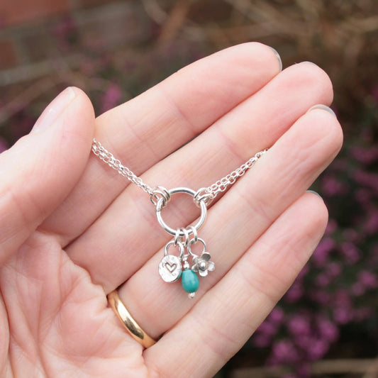 Sterling silver charm bracelet with turquoise gemstone