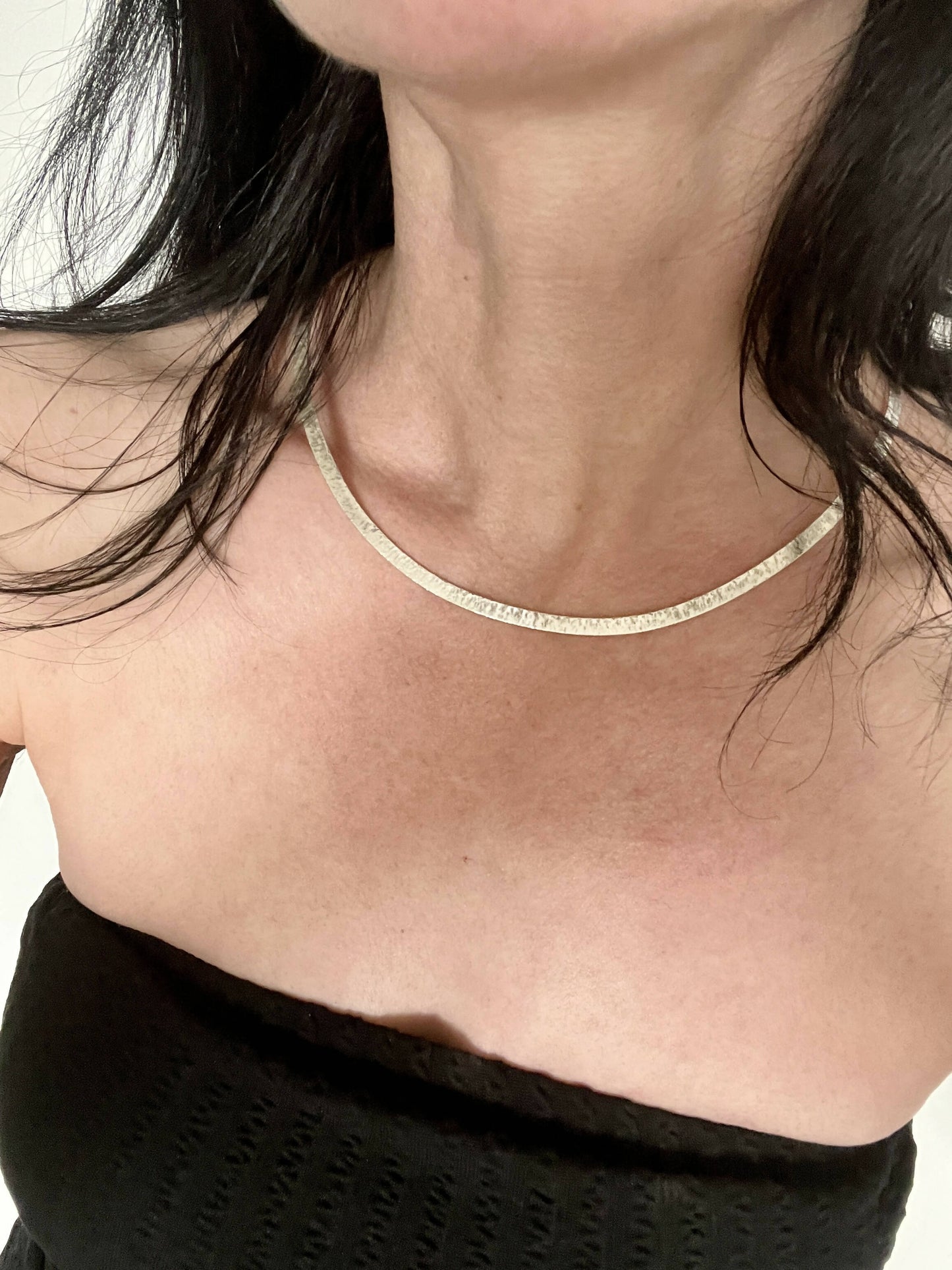 Hammered silver choker necklace.