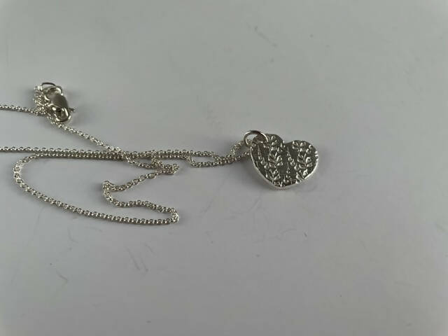 Fine silver heart with double sided pattern