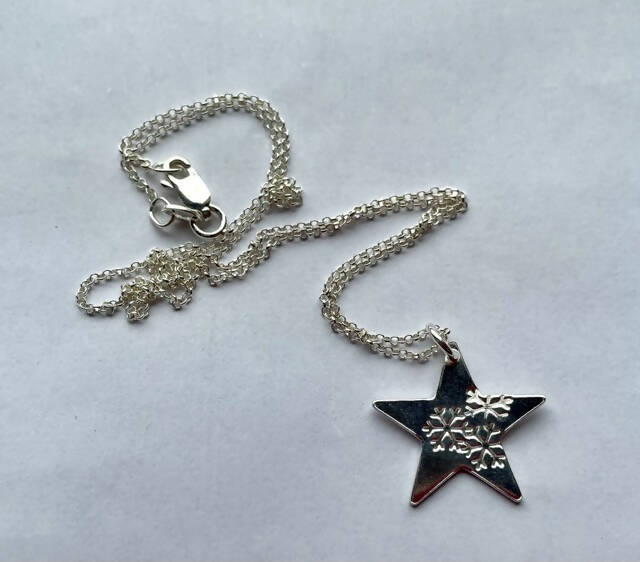 Sterling silver star and snowflake pendant