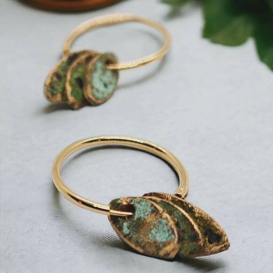 9K Gold Found Beneath Hoops